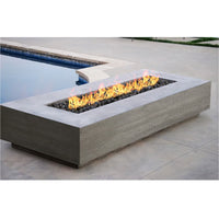 38-inch rectangular Tavola VI gas fire pit table by Prism Hardscapes in concrete with lava rock burning display