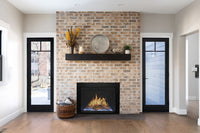 Modern Flames Orion Traditional firebox with surround trim installed in a brick fireplace opening