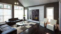 Napoleon Altitude X 36 gas fireplace lifestyle angle shot with driftwood media