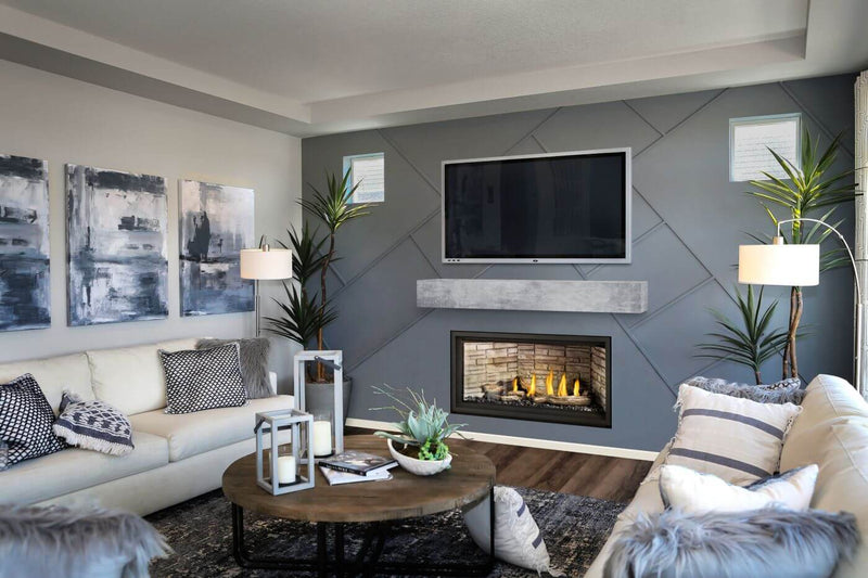 Napoleon Ascent Linear Premium 42 gas fireplace lifestyle shot with driftwood logs and lava rocks
