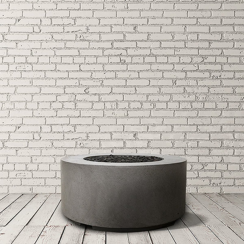 Cilindro Gas Fire Table round concrete fire pit by Prism Hardscapes with custom patina finish