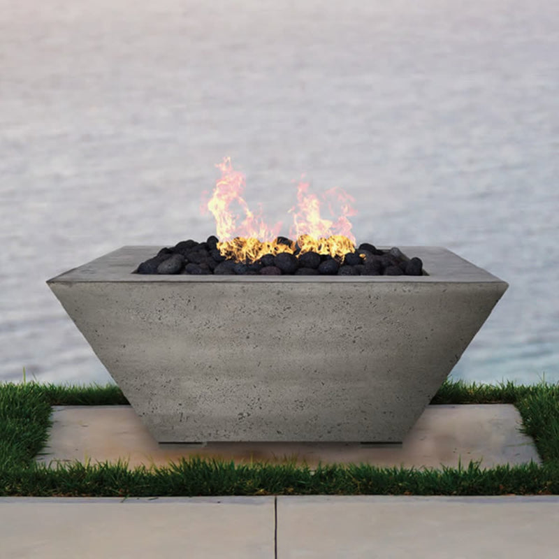 Lombard 40 inch square concrete fire pit table by Prism Hardscapes with lava rock burning display and customizable color options