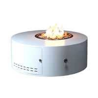 Isla Low Profile round powder coat steel fire pit table in outdoor setting