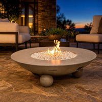 American Fyre Designs Versailles 54-Inch Round GFRC Gas Fire Table with Ball Feet — lifestyle
