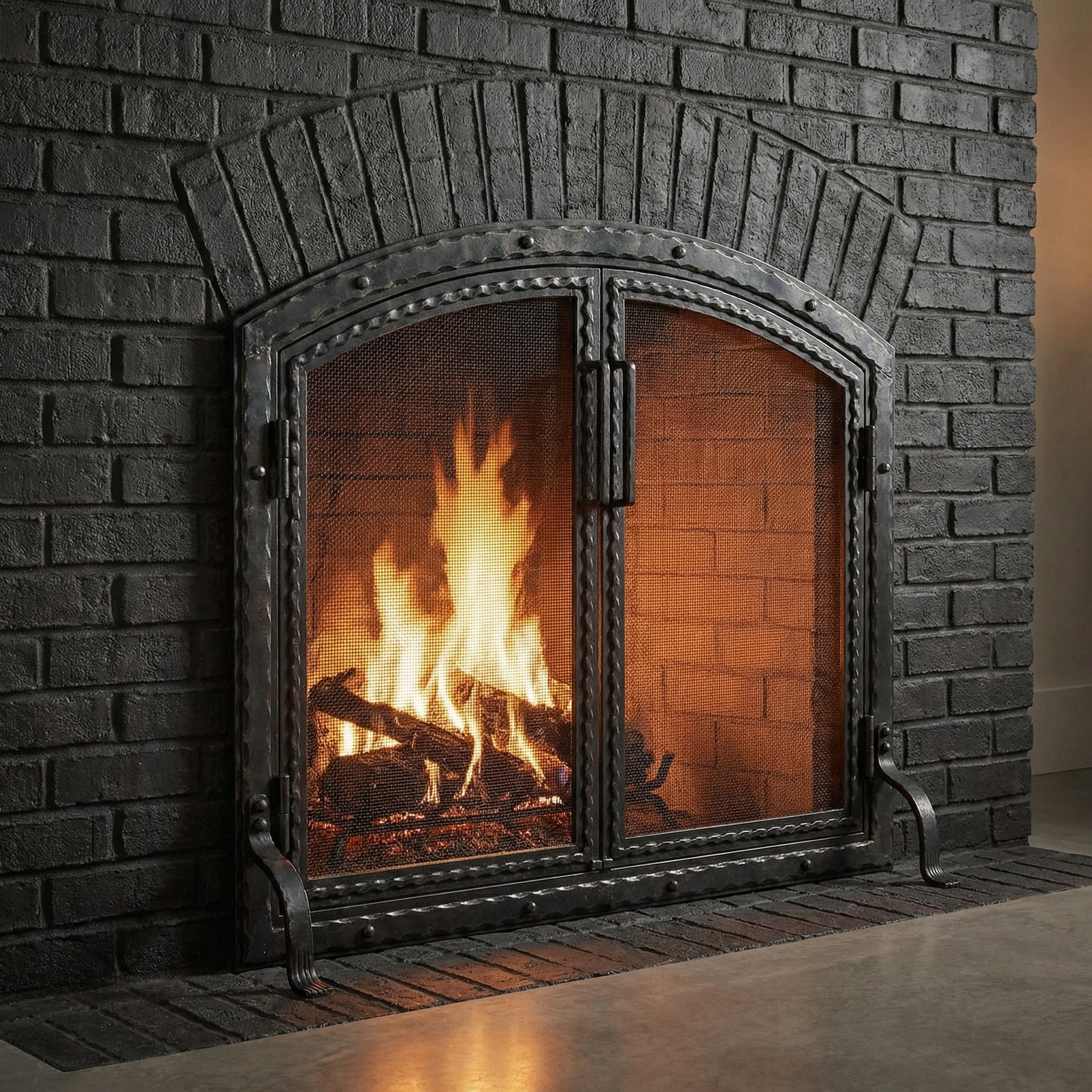 Custom free standing fireplace screen with thick steel frame and arch working doors