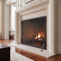 Hammered Edge fireplace screen in matte black at a limestone fireplace