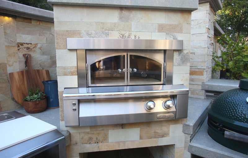 Built-in oven front view showing glass doors and controls in its enclosure