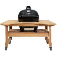 Primo Jack Daniels Edition Oval XL 400 Ceramic Kamado Grill with stainless steel grates on curved cypress table