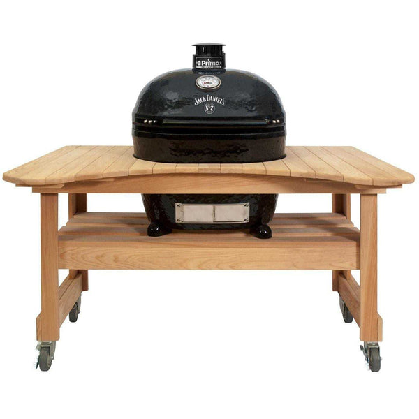 Primo Jack Daniels Edition Oval XL 400 Ceramic Kamado Grill with stainless steel grates on curved cypress table