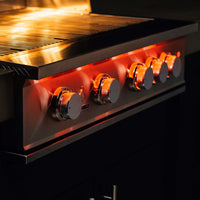 Close-up of TrueFlame 32 inch built-in grill control knobs with illuminated LED lighting
