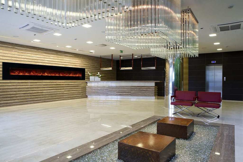 Modern Flames Ambiance 144-inch wall mount electric fireplace with vibrant flames in upscale hotel lobby