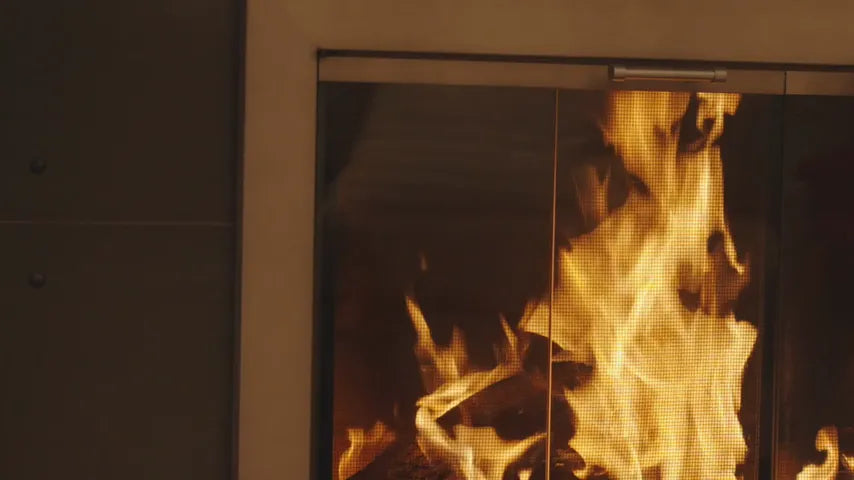 Play the 10-second film of fireplace doors, lit
